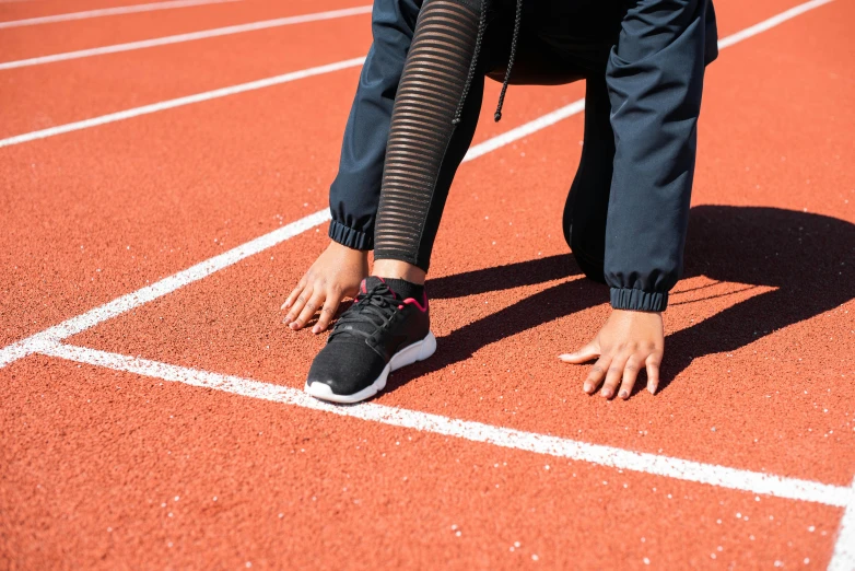 a person getting ready to run on a track, smart textiles, thumbnail, eight eight eight