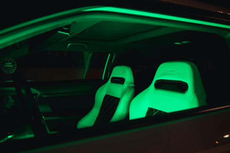 the interior of a car is lit up with green lights, rgb ethereal lighting, side lighting xf iq4, instagram picture, hexglow