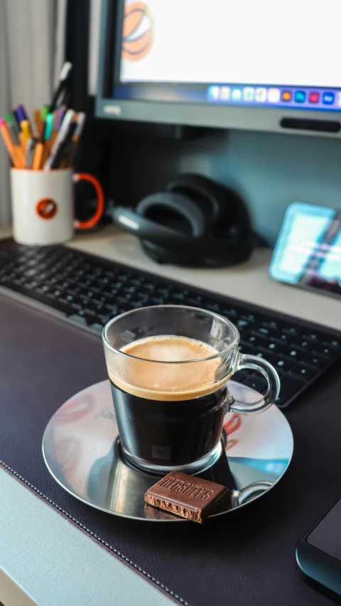 a laptop computer sitting on top of a desk next to a cup of coffee, pexels, vantablack gi, thumbnail, small, high quality photo