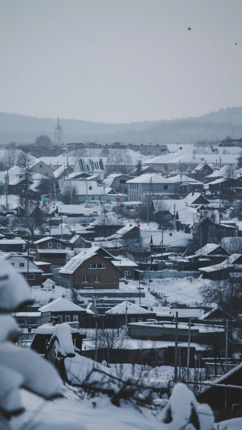 a view of a small town covered in snow, by Adam Marczyński, full frame image, square, high quality photo, thumbnail