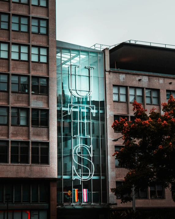 a couple of tall buildings sitting next to each other, unsplash contest winner, vancouver school, neon letters tripmachine, ut 4, letter s, ultra hi resolution picture