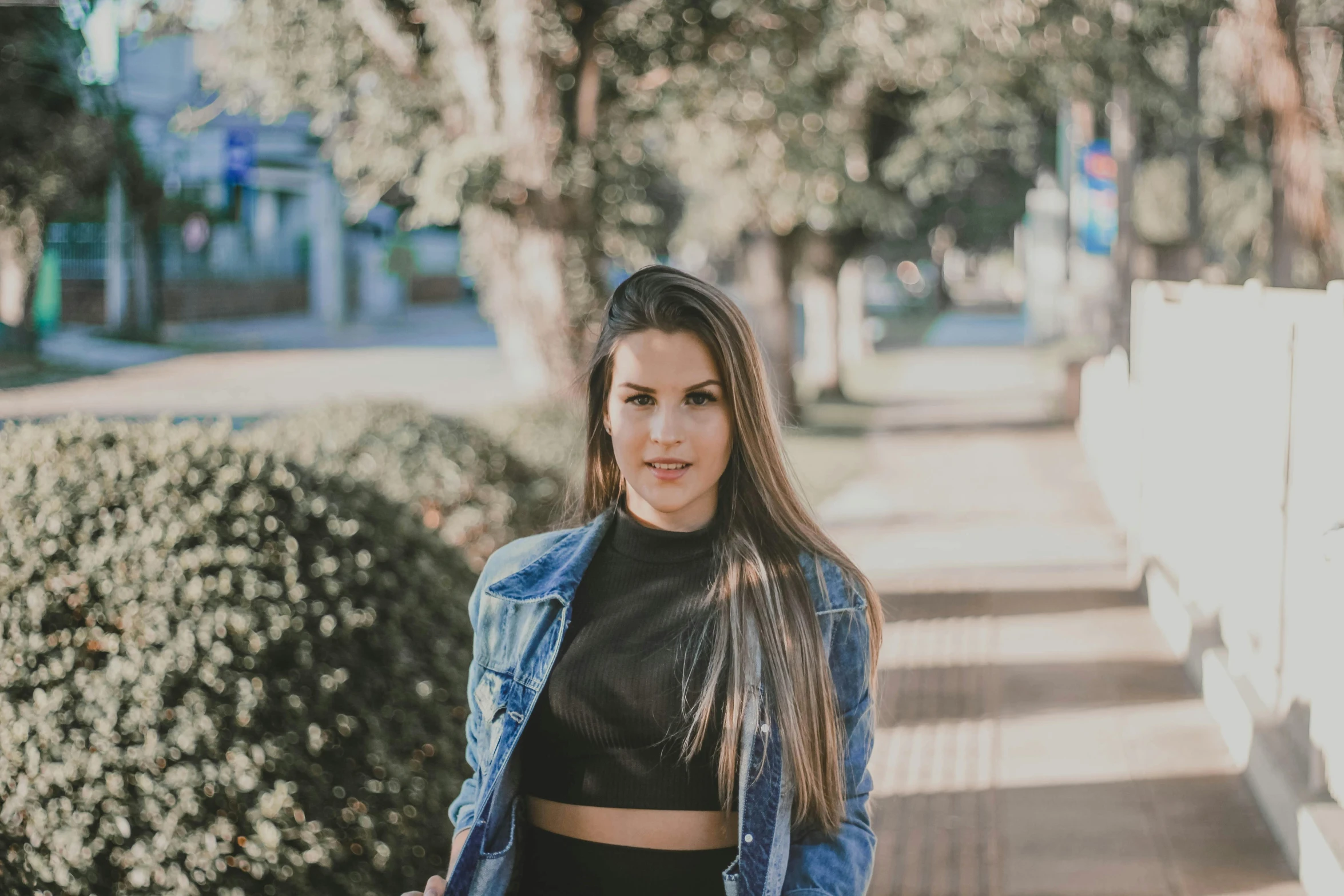 a beautiful young woman standing on a sidewalk, pexels contest winner, realism, wearing crop top, avatar image, candid portrait photo, 90's photo