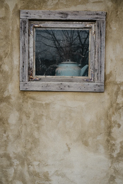 a white fire hydrant sitting in front of a window, a picture, inspired by Harriet Backer, teapot : 1, before a stucco wall, winter photograph, weathered olive skin