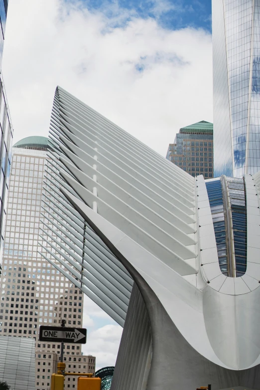 a large white sculpture in the middle of a city, inspired by Zaha Hadid, pexels contest winner, world trade center twin towers, calatrava, wall street, a quaint