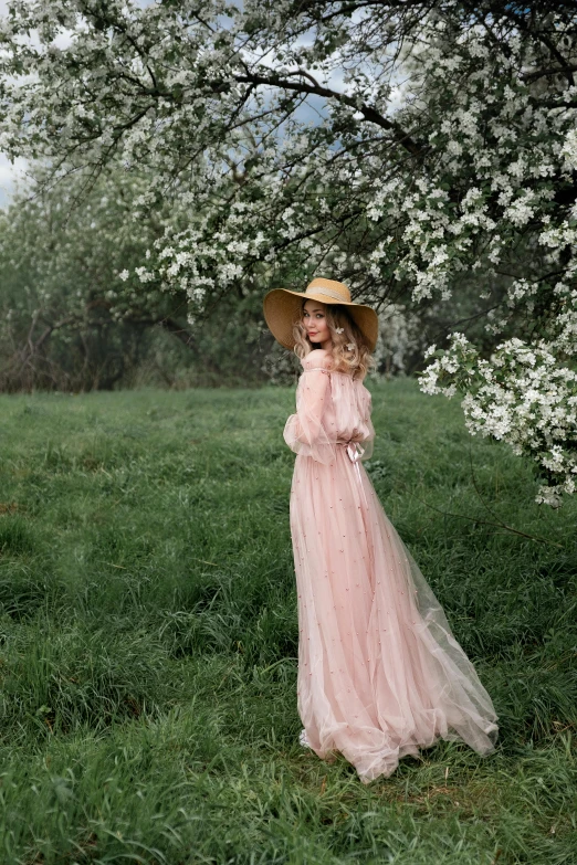 a woman in a pink dress and hat standing in a field, pexels contest winner, renaissance, valentin serov style, lush chic garden, square, peach