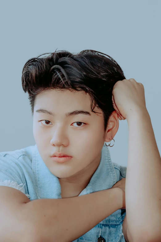 a close up of a person sitting at a table, an album cover, inspired by Yanjun Cheng, trending on pexels, realism, boyish face, ear floof, on clear background, young adorable korean face