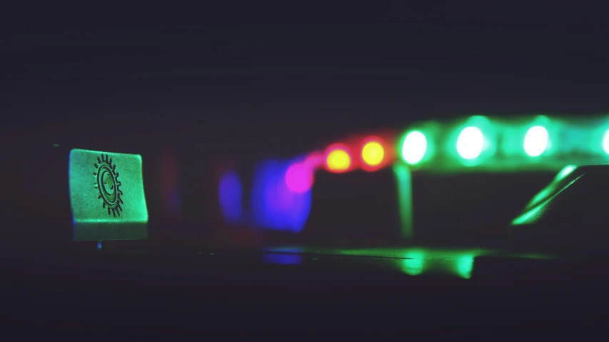 a computer mouse sitting on top of a keyboard, a microscopic photo, inspired by Elsa Bleda, unsplash, holography, night time dark with neon colors, 4k in plastic dark tilt shift, neon road, lonely!! stop light glowing