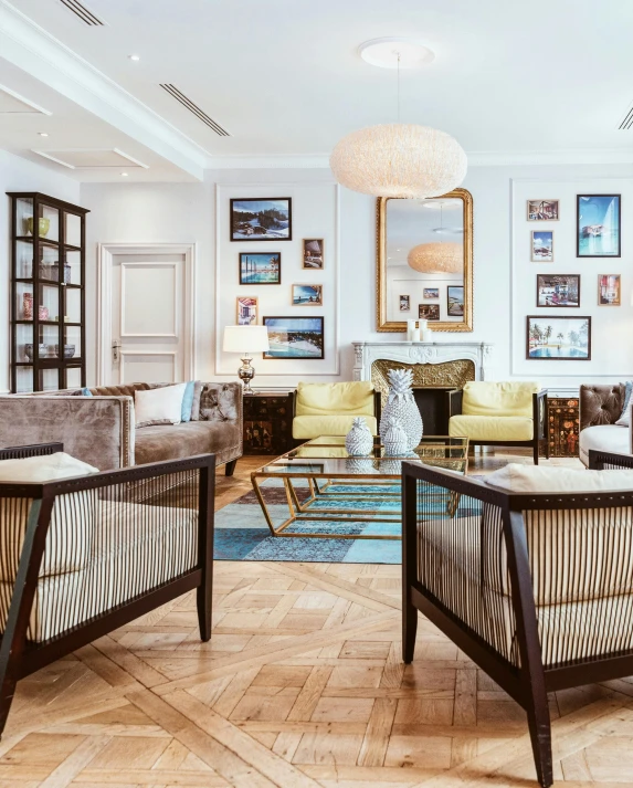 a living room filled with furniture and a fire place, inspired by Albert Paris Gütersloh, pexels contest winner, symmetrical image, beachfront mansion, gentleman's club lounge, oiled hardwood floors