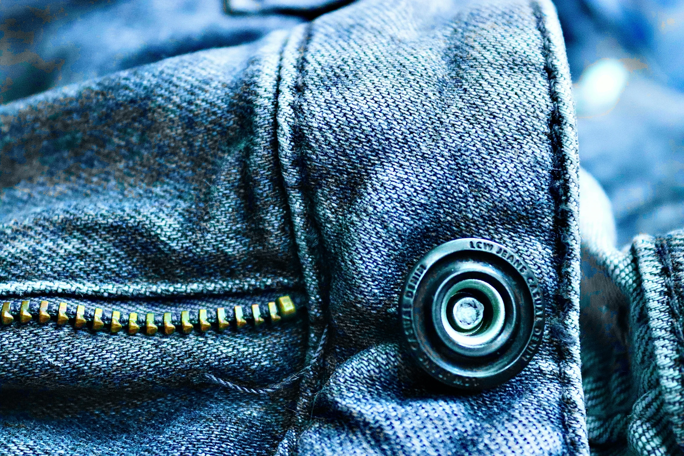 a close up of a button on a pair of jeans, a macro photograph, by Thomas Häfner, unsplash, visual art, blue - grey gear, zippers, cyberpunk clothes, shot on kodak vision 200t