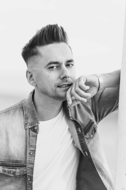 a black and white photo of a man holding a surfboard, inspired by Daniël Mijtens, ray william johnson, headshot profile picture, pompadour, jovana rikalo