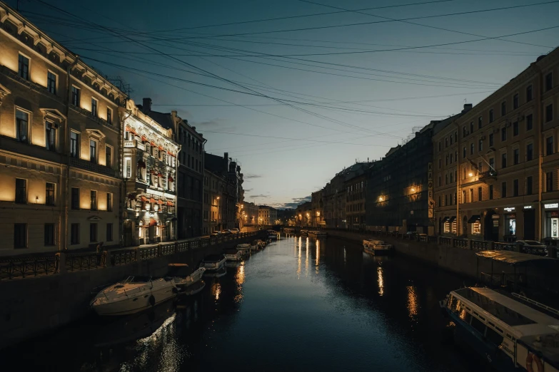 a river running through a city next to tall buildings, pexels contest winner, hyperrealism, saint petersburg, muted lights, canals, view from the side”