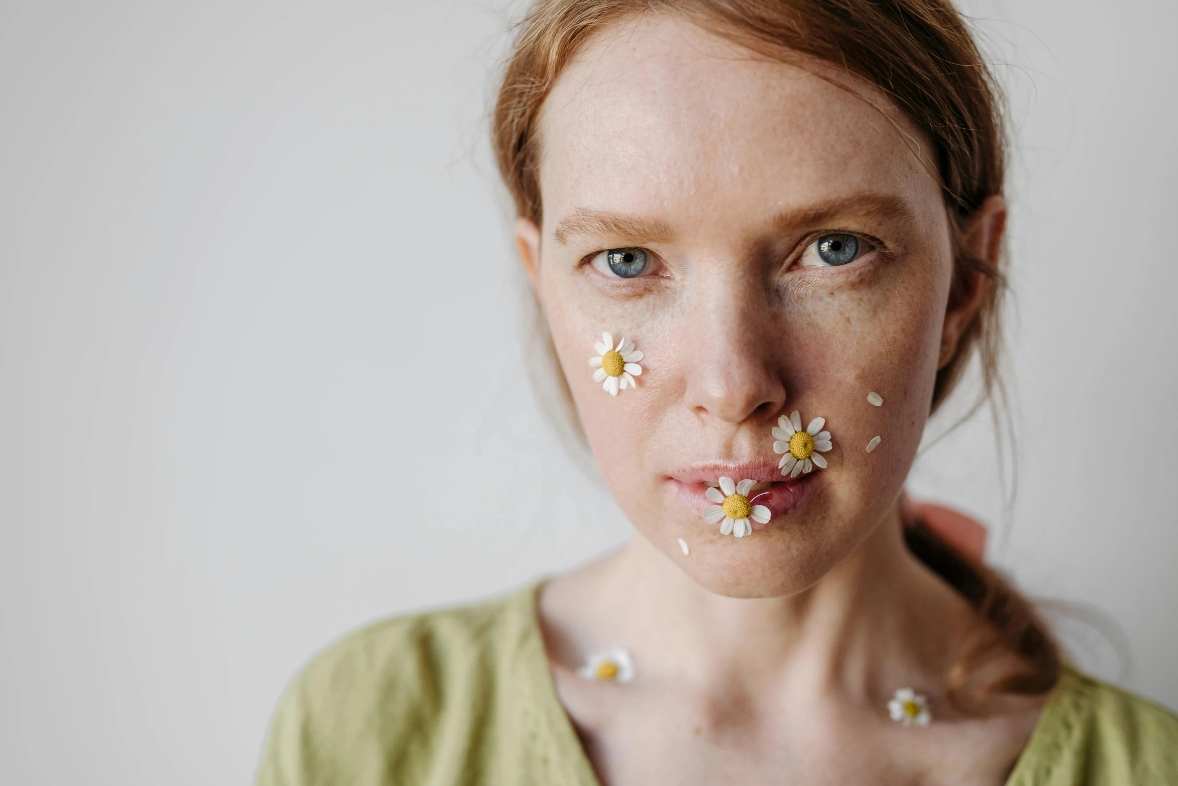 a woman with flowers all over her face, by Ellen Gallagher, trending on pexels, chamomile, scars on face, clean face and body skin, pale face