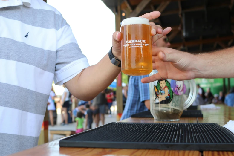 a close up of a person holding a glass of beer, “the ultimate gigachad, market, lachlan bailey, pouring