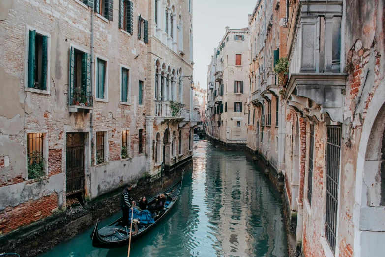 a couple of boats that are in the water, by Julia Pishtar, pexels contest winner, gondola, shady alleys, 🚿🗝📝