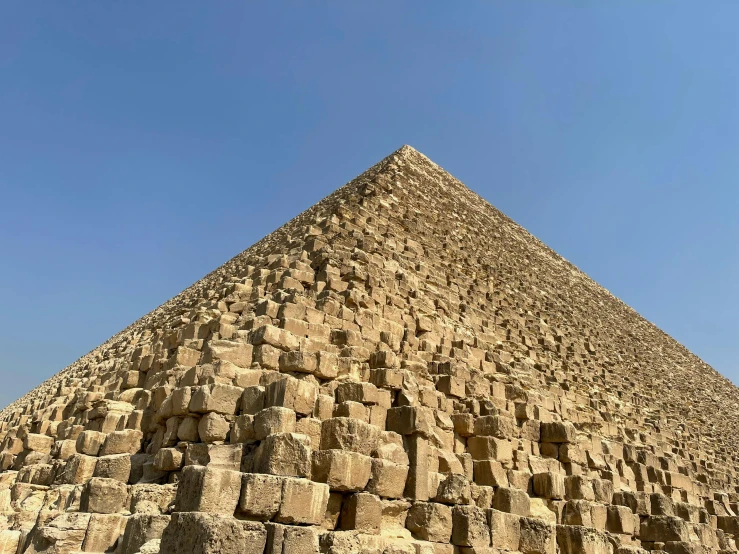 the great pyramid of giza in egypt, egyptian art, by Tom Wänerstrand, pexels contest winner, hyperrealism, low angle photograph, 🦩🪐🐞👩🏻🦳, ready to eat, huge and megalithic