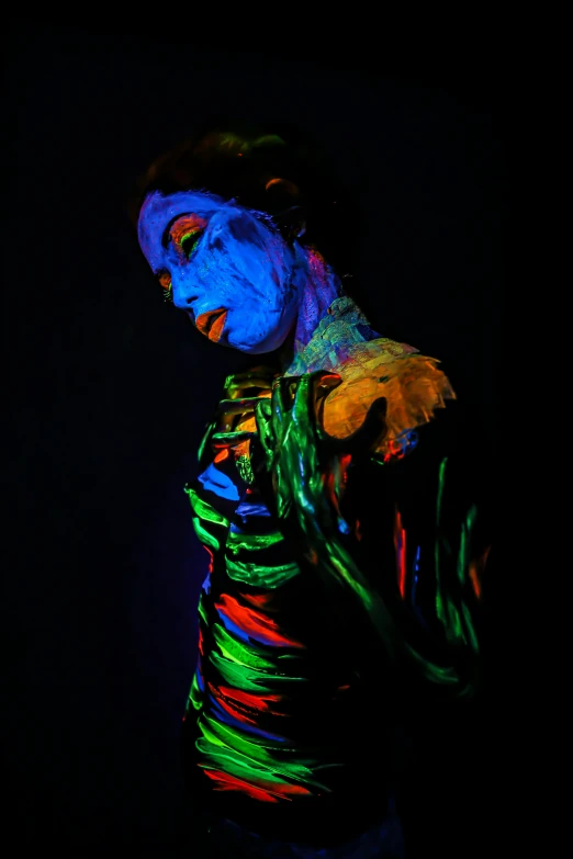 a man that is standing in the dark, inspired by Alberto Seveso, pexels contest winner, day - glow facepaint, painting of a woman, ( colorful ), made of glowing oil