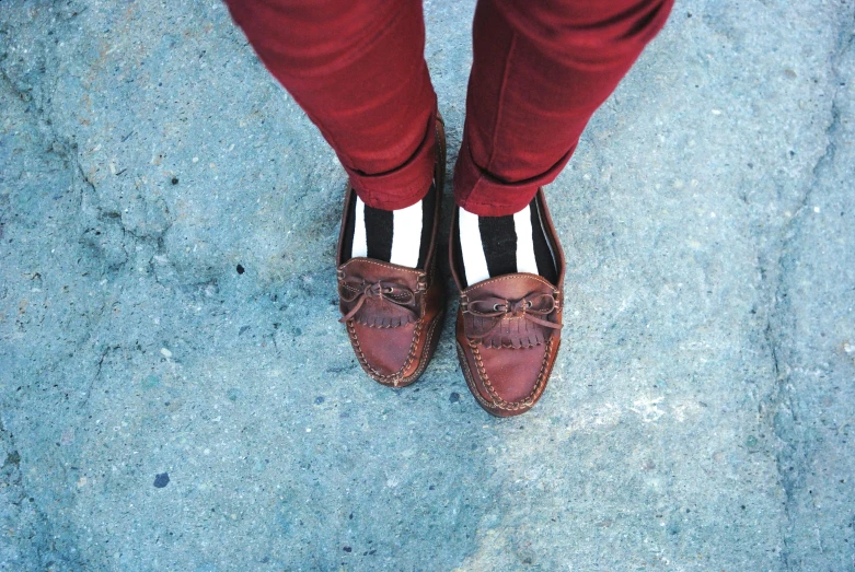 a person wearing red pants and brown shoes, inspired by Wes Anderson, trending on pexels, striped, hipster, snapchat photo, leather shoes