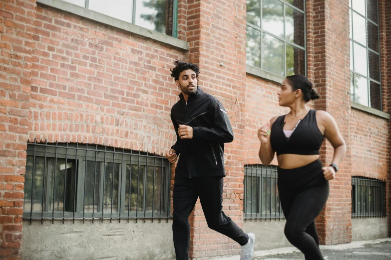 a man and a woman jogging in front of a brick building, profile image, thicc build, thumbnail, performance