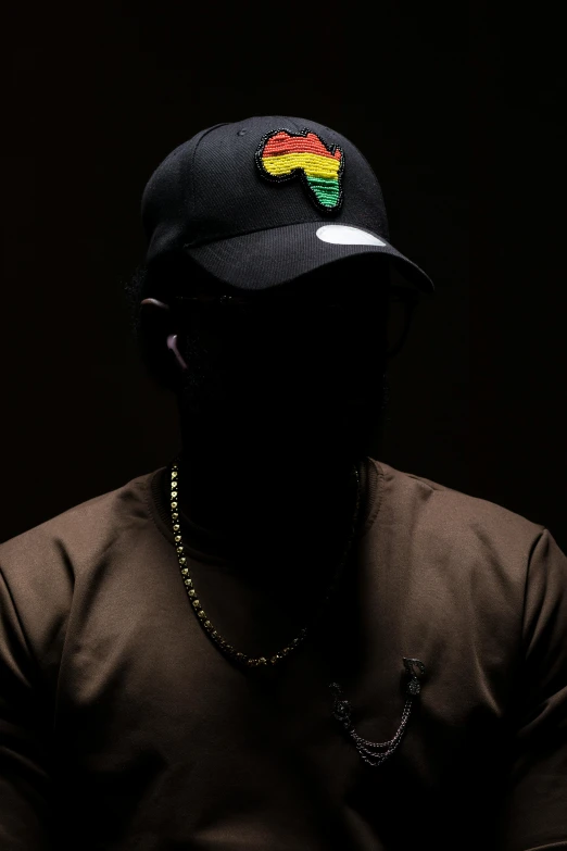 a man in a black shirt and a black hat, an album cover, inspired by Ras Akyem, trending on pexels, ( ( brown skin ) ), shattered visor, silhouette :7, multi colored