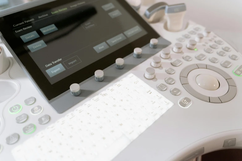 a tablet computer sitting on top of a white desk, a photocopy, by Julian Allen, unsplash, medical machinery, softly glowing control panels, close up details, intricate wlop