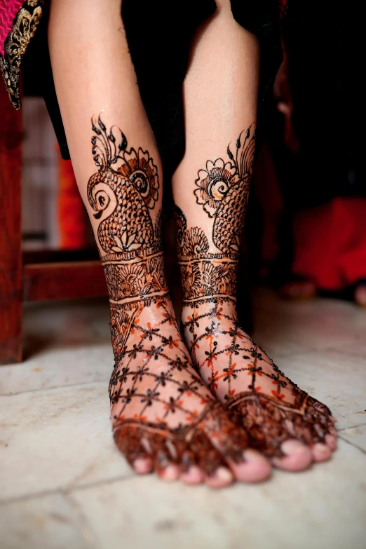 a woman's feet with henna tattoos, a tattoo, intricate illuminated lines, tall, full - body artwork, worn