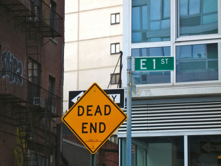 a dead end sign hanging from the side of a building, a photo, reddit, street art, crowded streets, ignant, death grips, 2000s photo