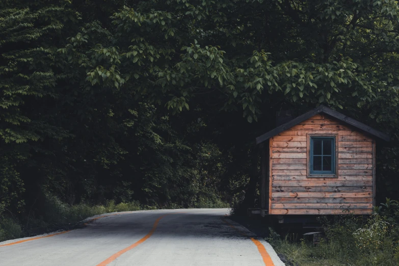 a small wooden cabin sitting on the side of a road, pexels contest winner, high resolution image, thumbnail, background image, high resolution photo