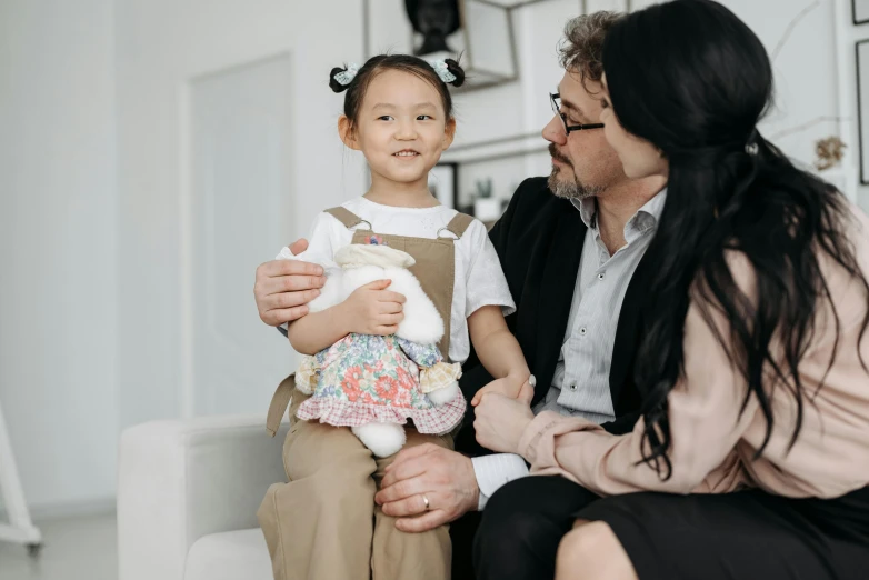 a woman sitting next to a little girl on a couch, pexels contest winner, michael kaluta and jia ruan, wearing an elegant outfit, father holds child in the hand, avatar image