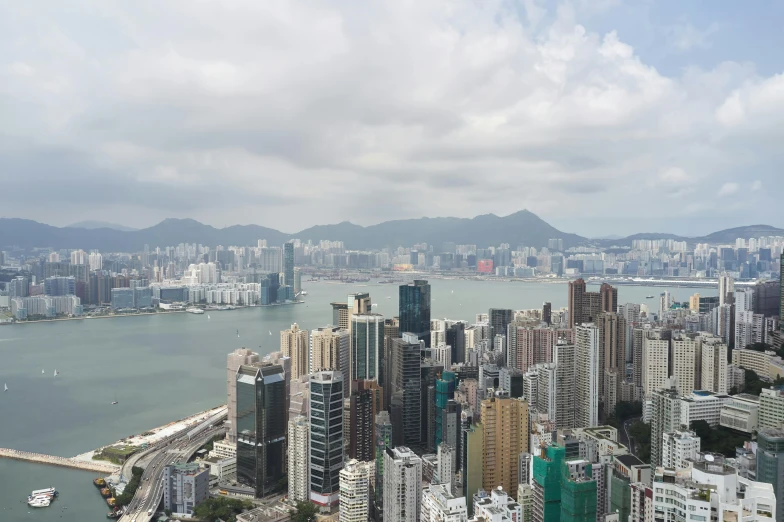 a view of a city from the top of a building, pexels contest winner, hyperrealism, hong kong buildings, slight haze, 8 k hi - res, 2000s photo