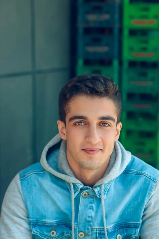 a man in a denim jacket posing for a picture, young greek man, profile image, zaha hadi, greens)