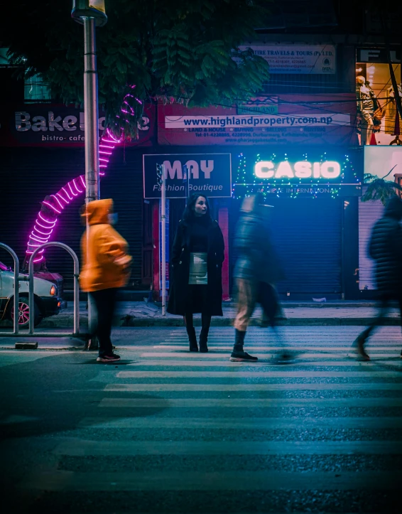 a group of people walking across a street at night, an album cover, unsplash contest winner, neon electronic signs, non binary future world, photo for a magazine, tourist photo