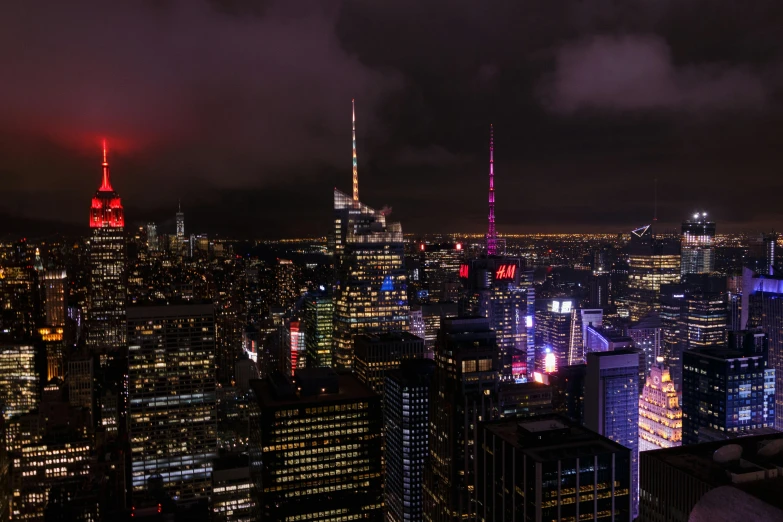 a view of a city at night from the top of a building, gloomy lights in the sky, times square, 2022 photograph, gigapixel photo