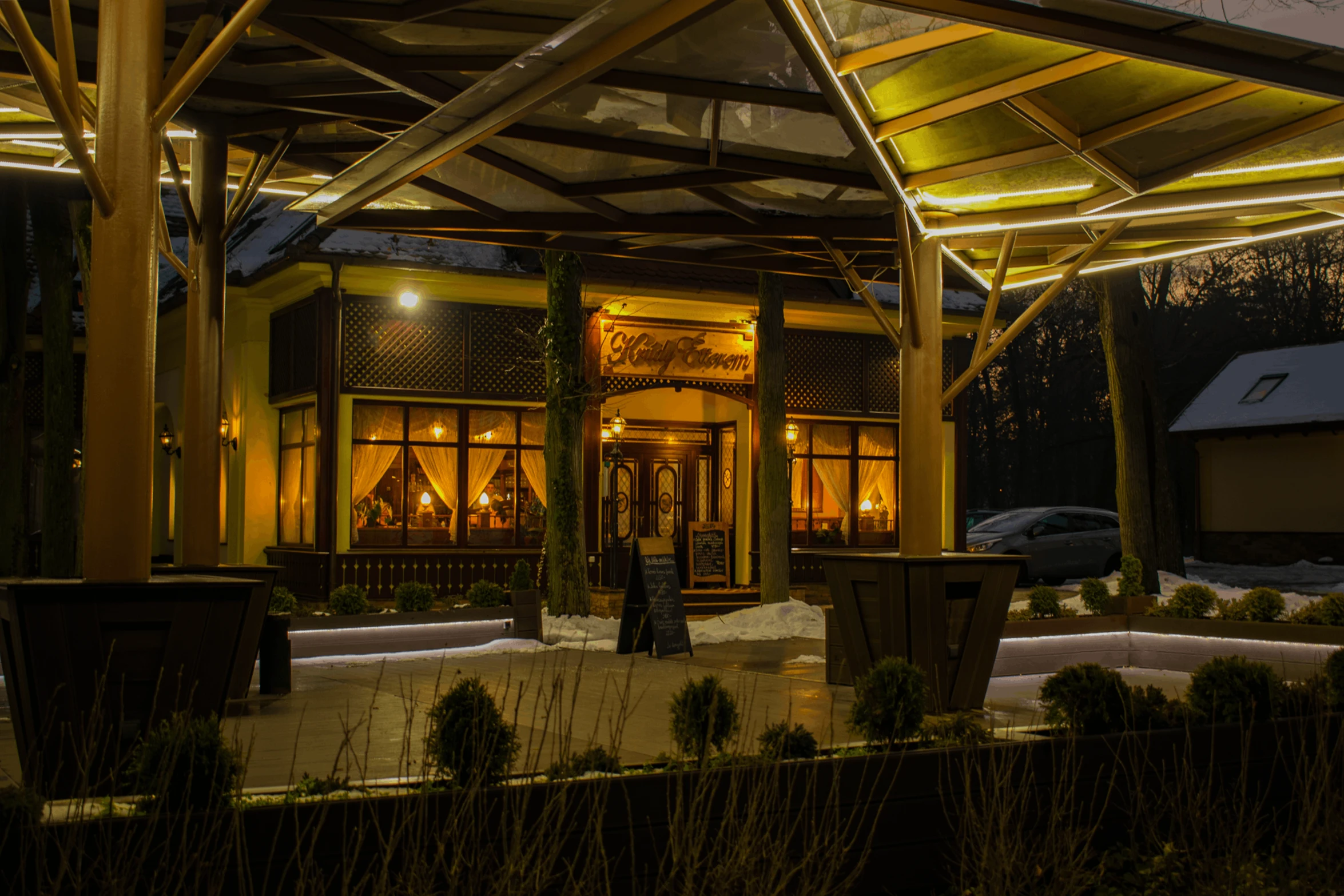 the outside of a restaurant lit up at night, by Hristofor Zhefarovich, high detailed photo, spring evening, luxurious environment, winter