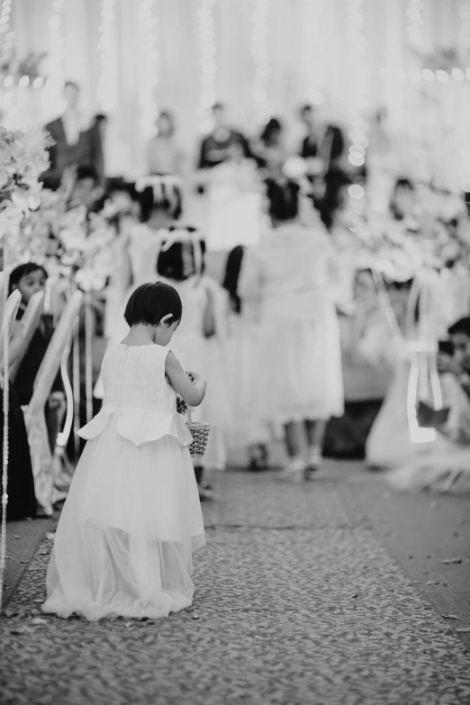 a little girl is walking down the aisle, a black and white photo, by Albert Welti, instagram picture, 15081959 21121991 01012000 4k, pastel', sha xi