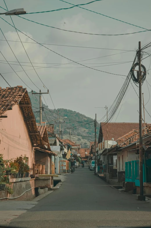 a view of a street through a car window, by Andrée Ruellan, trending on unsplash, view of villages, coban, pastel hues, square