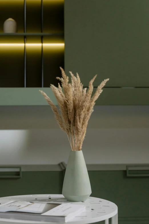 a vase that is sitting on a table, inspired by Elsa Bleda, modernism, phragmites, low - angle shot, muted colors. ue 5, arborescent architecture