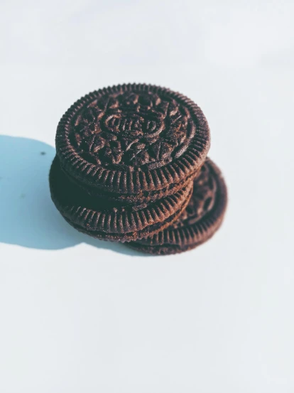 two oreo cookies sitting on top of each other, unsplash, photorealism, 🎀 🧟 🍓 🧚, profile pic, high quality photo, ilustration