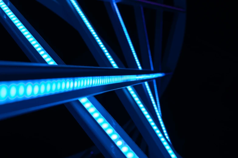a ferris wheel with blue lights in the dark, by Thomas Häfner, pexels contest winner, kinetic art, dan flavin, detail studio quality lighting, rgb wall light, light-blue