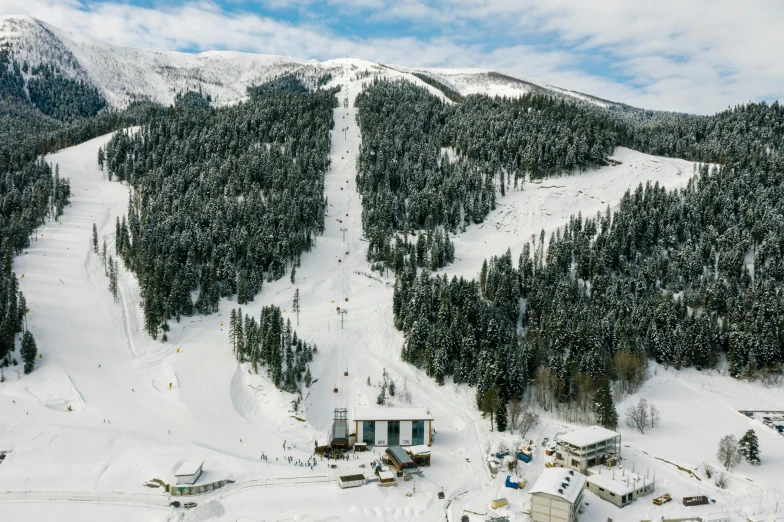 an aerial view of a ski resort in the mountains, a portrait, pexels contest winner, hurufiyya, southern slav features, thumbnail, located in hajibektash complex, grey