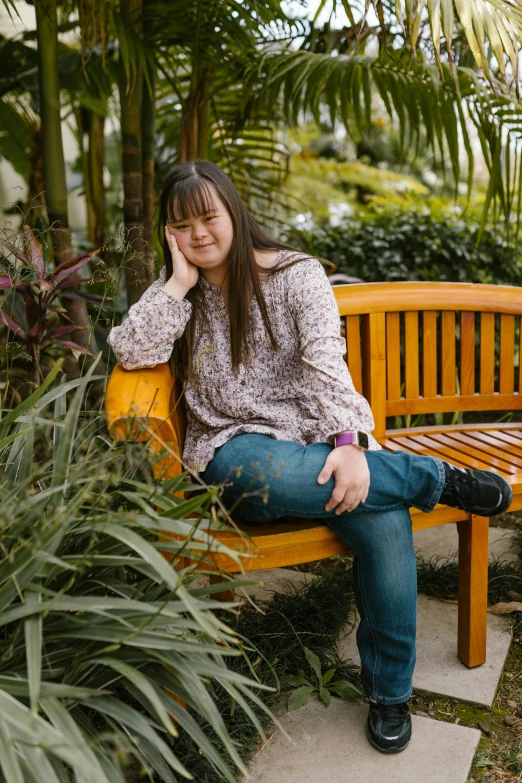 a woman sitting on top of a wooden bench, brown hair and bangs, standing in a botanical garden, portrait of christy ren, tran ross