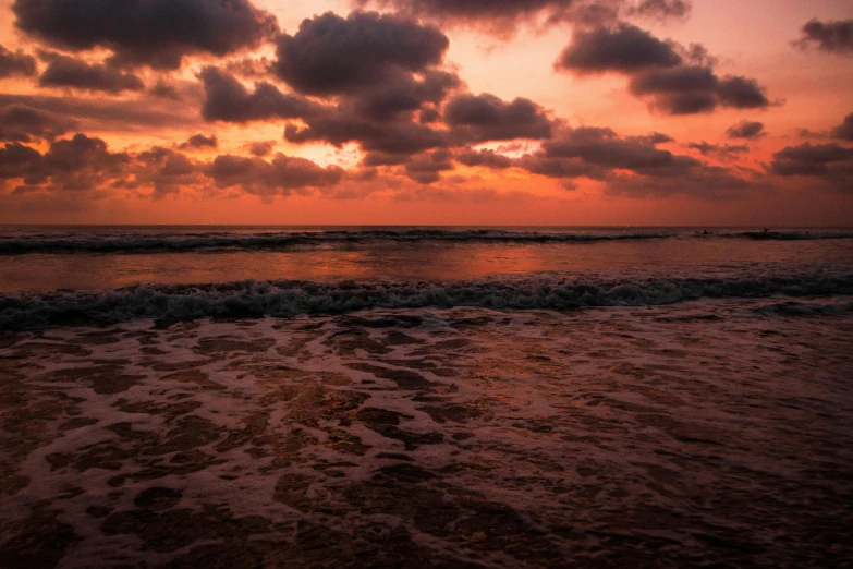 the sun sets over the ocean on a cloudy day, by Daniel Lieske, pexels contest winner, pink and orange colors, sri lanka, torrent, the sky is red