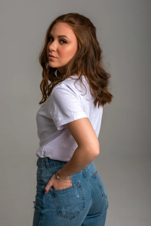a woman in a white shirt and blue jeans, an album cover, trending on unsplash, photorealism, acting headshot, pokimane, curvy accentuated booty, white t-shirt