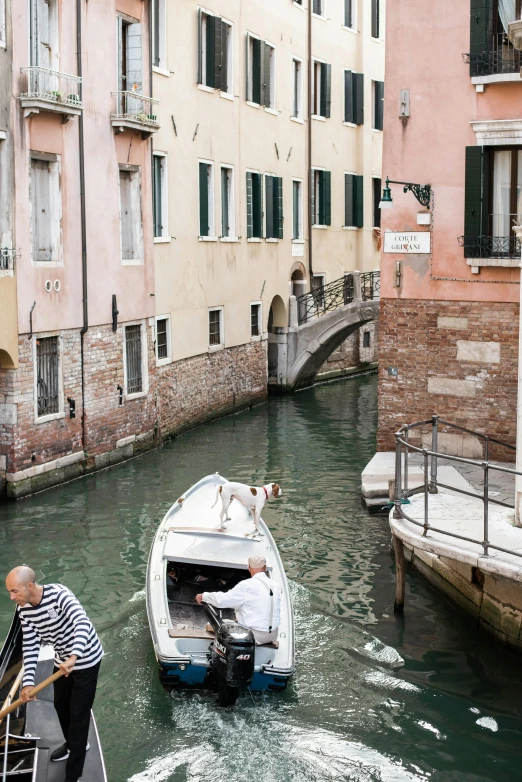 a couple of boats that are in the water, a photo, by Carlo Martini, renaissance, narrow and winding cozy streets, 2022 photograph, top, brown