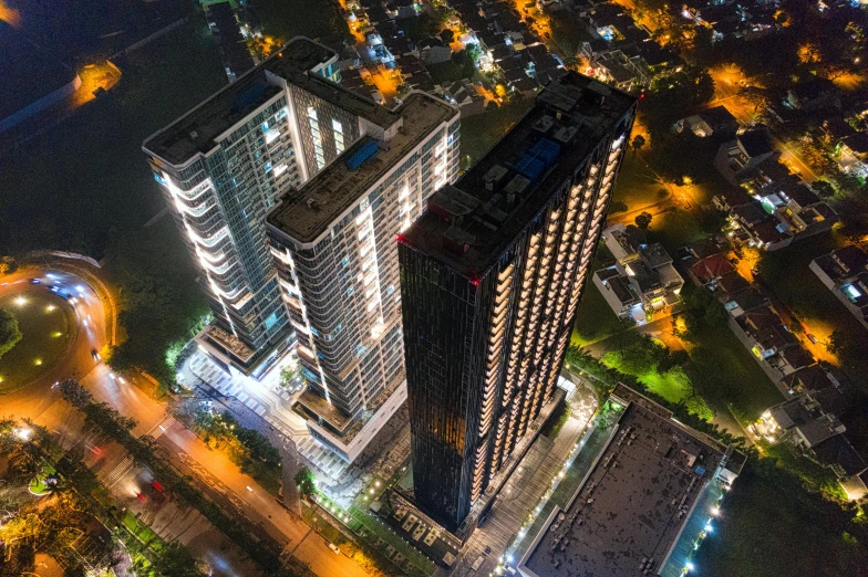 an aerial view of a city at night, a portrait, unsplash contest winner, bauhaus, south jakarta, two towers, high angle uhd 8 k, cascading highrise