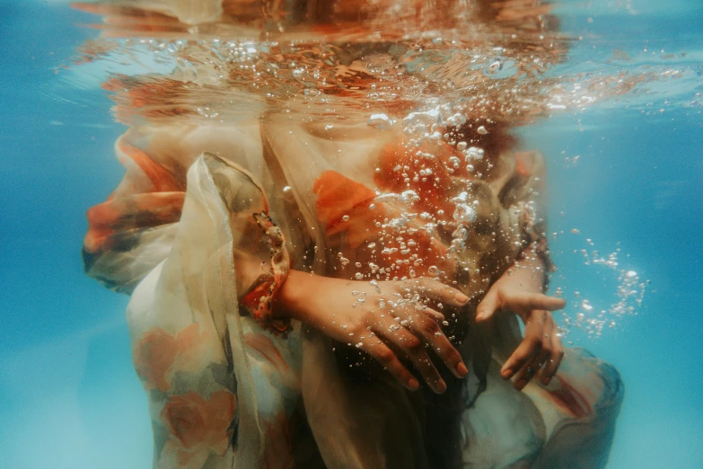 a woman in a white dress under water, pexels contest winner, renaissance, teal and orange colors, woman holding another woman, transparent liquid, uncropped