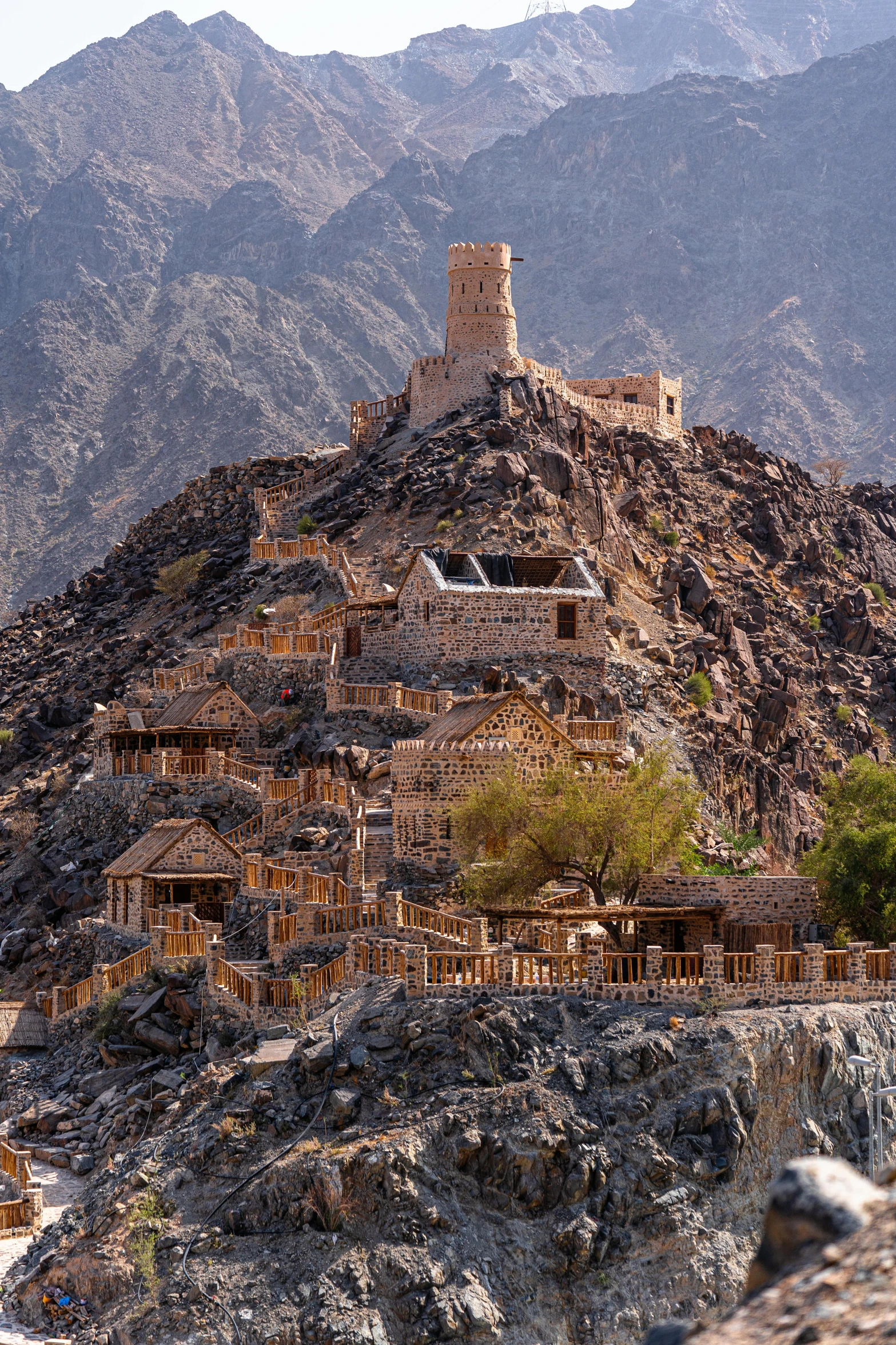 a mountain with a castle on top of it, dau-al-set, huts, arabic architecture, no crop, multiple stories