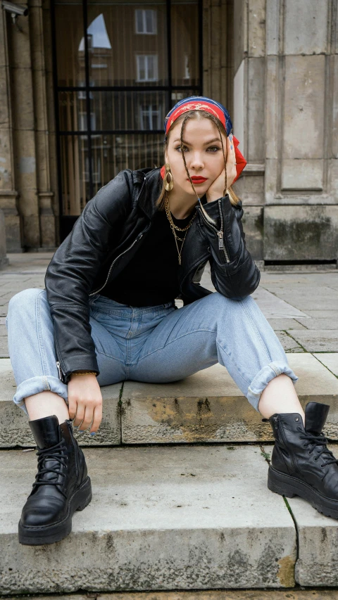 a woman sitting on the steps of a building, by Nina Hamnett, trending on pexels, renaissance, dressed in punk clothing, eleanor tomlinson, berets, promotional image