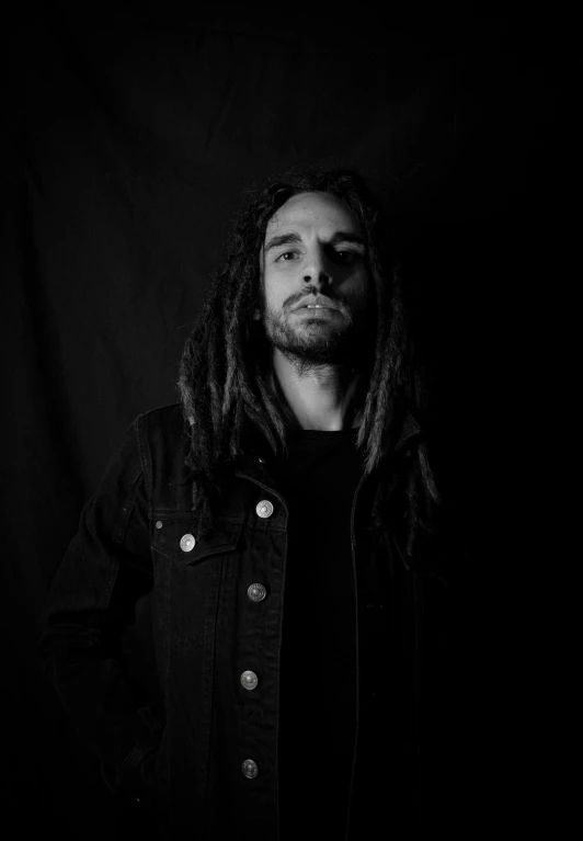 dread dread dread dread dread dread dread dread dread dread dread dread dread dread dread dread dread dread, a black and white photo, inspired by Jeremy Henderson, antipodeans, standing with a black background, headshot profile picture, miguel iglesias, a man wearing a black jacket