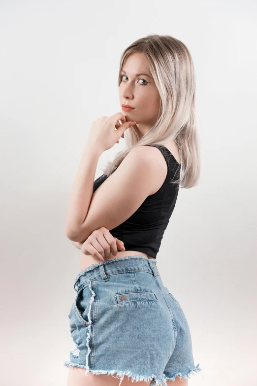 a woman in a short skirt posing for a picture, inspired by Jean Hey, reddit, photorealism, ( ( ( wearing jeans ) ) ), platinum blonde, ultra realistic photo, 5 0 0 px models