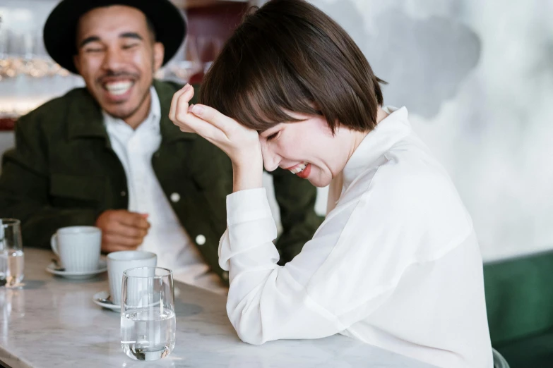 a couple of people that are sitting at a table, pexels contest winner, happening, laughing your head off, emma watson with anxious, kiko mizuhara, frustrated